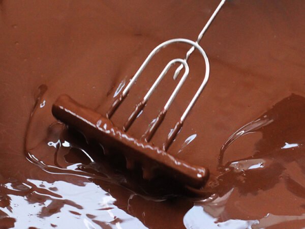 For Rum, Gin, and Tequila, we select 55% double fermentation dark chocolate, Single Origin—Pure Brazil. Once the cocoa is harvested, it goes through traditional fermentation processes, which give it a lively taste. After the first fermentation, the cocoa is placed with passion fruit for the second fermentation. During this time, the passion fruit ferments with the cocoa bean, giving it an additional fruity flavor. This single origin chocolate from Brazil brings a full texture of lively flavor, and the double fermentation enhances its fruity flavor to another level. You can even smell the fruity passion fruit aroma before tasting.